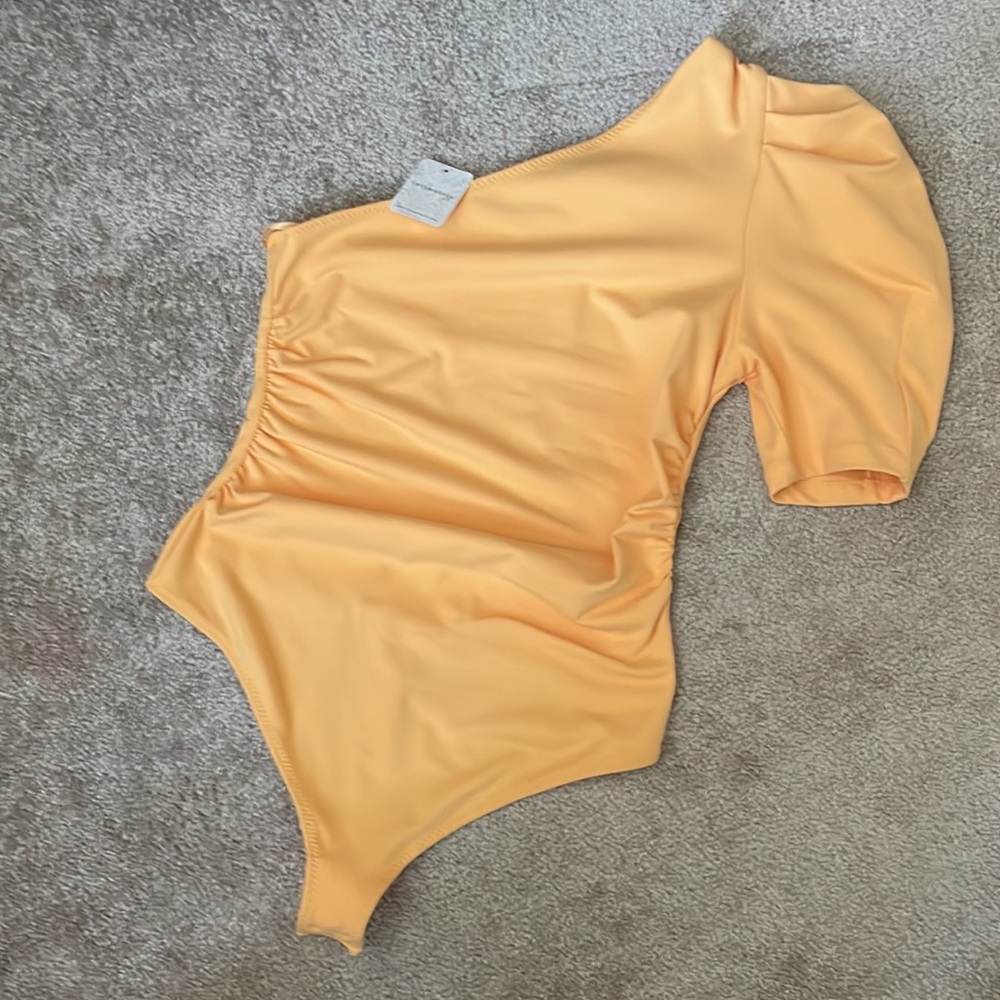 NWT Intimately by Free People one sleeve body suit Sunset Gold size Small